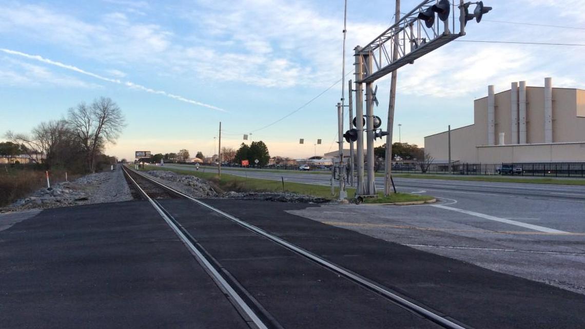 Warner Robins police are investigating the death of a woman who was lying on train tracks and was hit at about 12:45 a.m. Thursday near the Green Street crossing