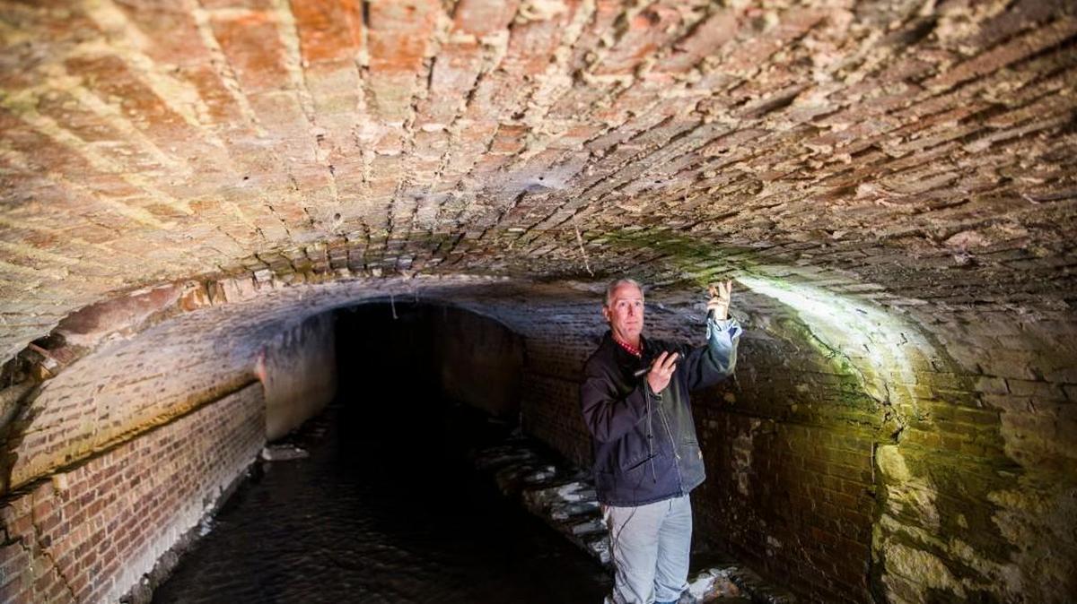 Clay Murphey, who oversees special sales tax-funded projects in Macon-Bibb County, points out in February how the stormwater culvert running underneath Second and Hazel streets in Macon is in danger of falling in.