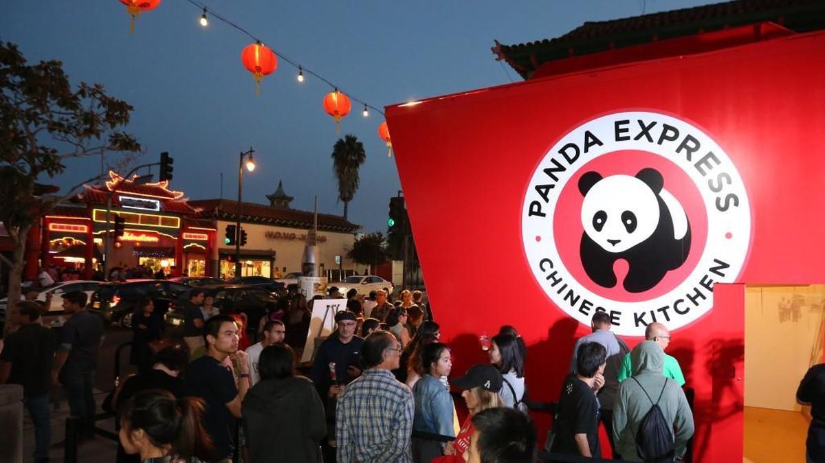 Festival attendees line up at the world’s largest take-out box to try Panda Express’ General Tso’s Chicken at Chinatown Summer Nights on Saturday, Aug. 20, 2016, in Los Angeles.