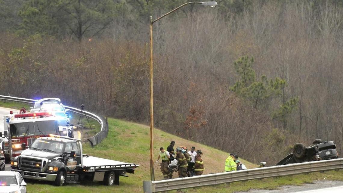 Emergency personnel work an accident where Shannon Duke, 44, of Warner Robins died when she lost control of her vehicle after her tire blew out at the Interstate 75 South exit of Interstate 16 according to Bibb County Deputy Coroner Lonnie Miley.