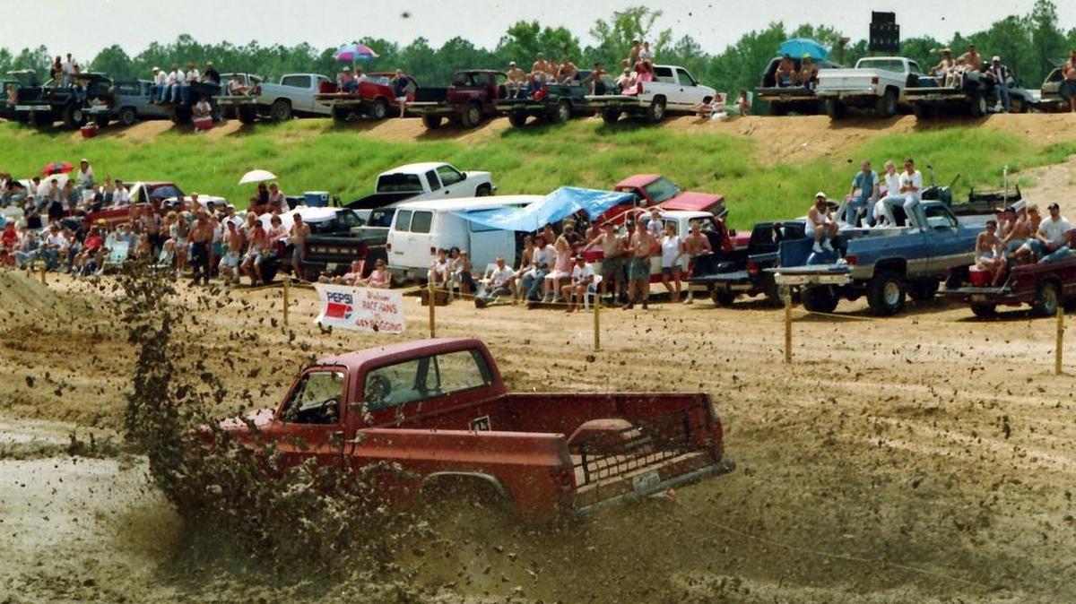 1996 FILE PHOTO: For many who found the Centennial Olympic Games in Atlanta a bit distant and dangerous to attend, Dublin radio station WQZY promoted the Summer Redneck Games as an alternative. Contestants in events ranging from big hair competition to mud bogging drew fans of southern culture to their venues--a rural race track and a motel parking lot.