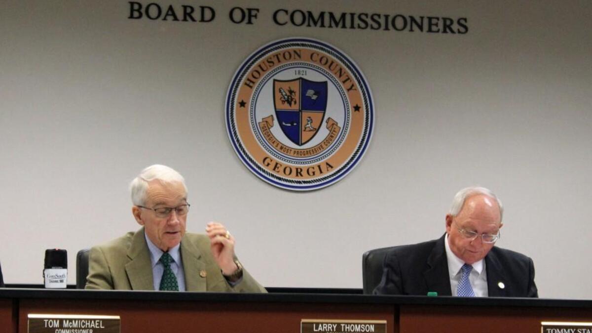 Houston County Commissioner Larry Thomson, left, talks about the need for more jailers at Tuesday's commission meeting as Chiarman Tommy Stalnaker listens.