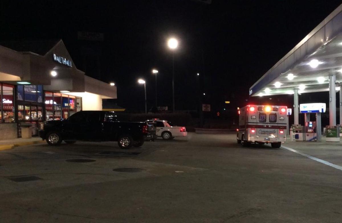 A shooting victim from the FairBridge Inn Express on Riverside Parkway is treated in an ambulance at the Walthall on Tom Hill Sr. Boulevard just after 4:30 a.m. Thursday.