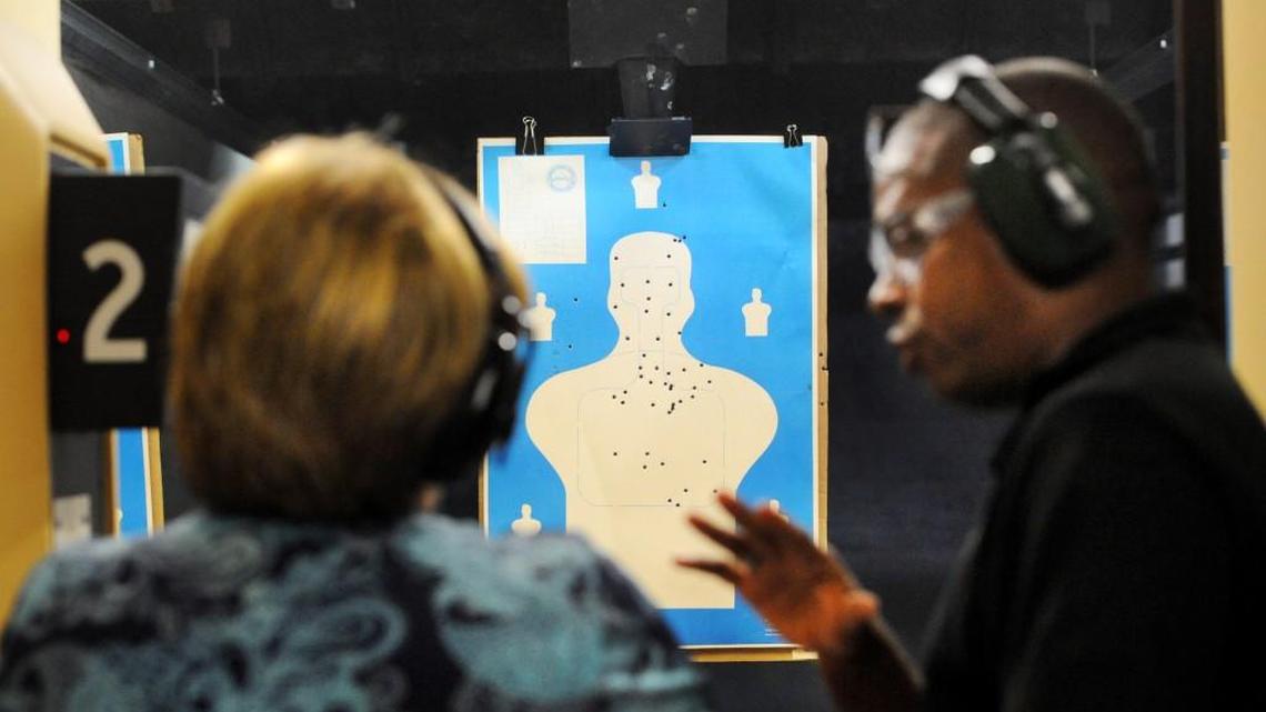 Lori Walker receives instruction from Lt. Kelvin Harris at the gun safety class in Macon back in 2013.