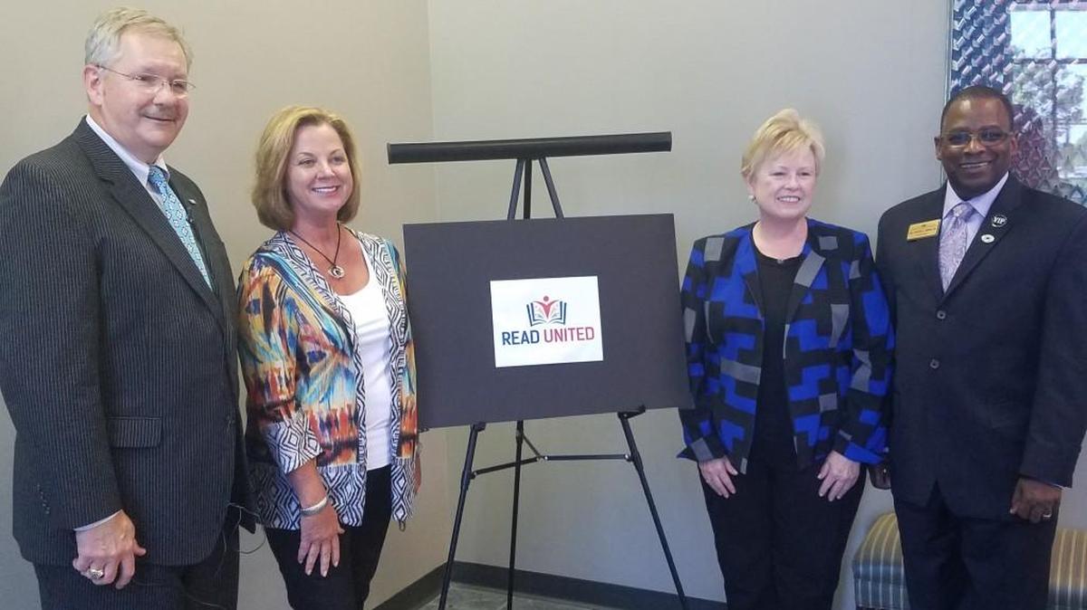 From left, United Way of Central Georgia President and CEO George McCanless, Peyton Anderson Foundation President Karen Lambert, Knight Foundation Program Director Beverly Blake and Bibb County schools Superintendent Curtis Jones stand in front of the new Read United program logo.