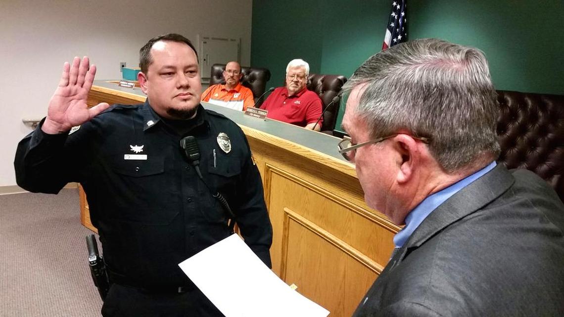 Charles “Chuck” Hadden is sworn in as Centerville’s new police chief by Mayor John Harley as City Council members Cameron Andrews and Randall Wright look on Tuesday night.