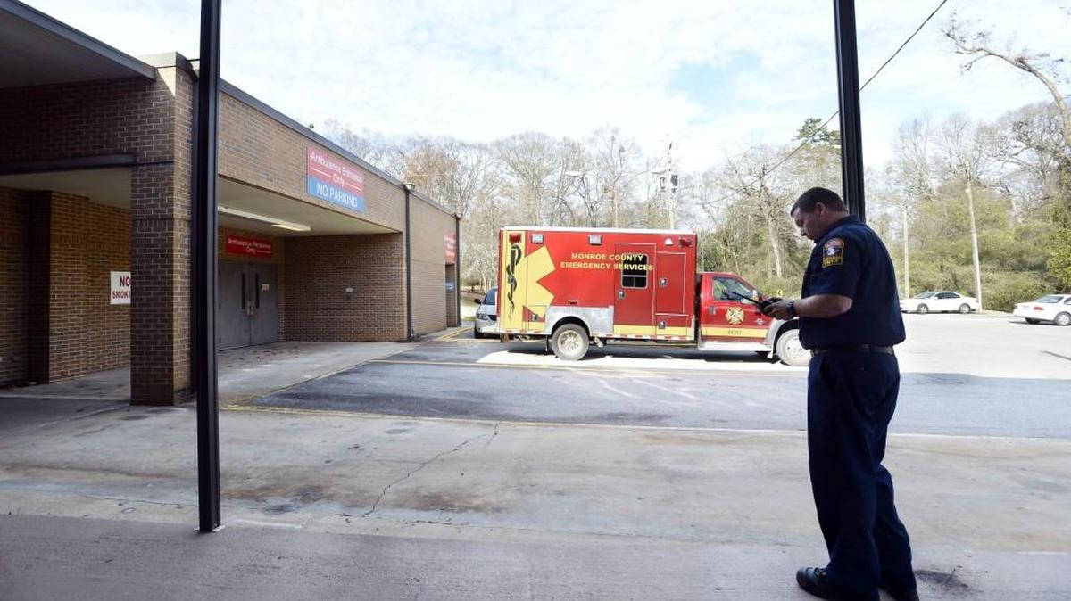 Monroe County EMT Matthew Perry waits for his next call near the county hospital’s emergency room where he says they average about 14 calls per day. Of that, more than half the patients require transportation and that keeps the six-bed emergency room hopping.