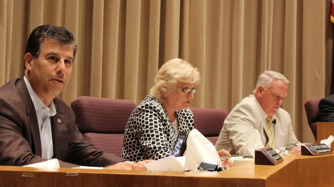 Warner Robins City Councilman Chuck Shaheen, left, speaks at Monday’s City Council meeting as council members Carolyn Robbins and Keith Lauritsen listen. Shaheen said the city has one of the lowest rates for water usage in the area.