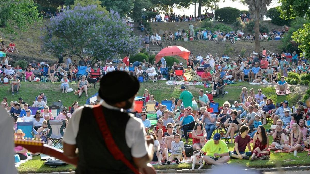 The A. J. Ghent band performs for a crowded Washington Park audience that barely flinched when he they began playing “Purple Rain” and as if on cue, a shower followed.