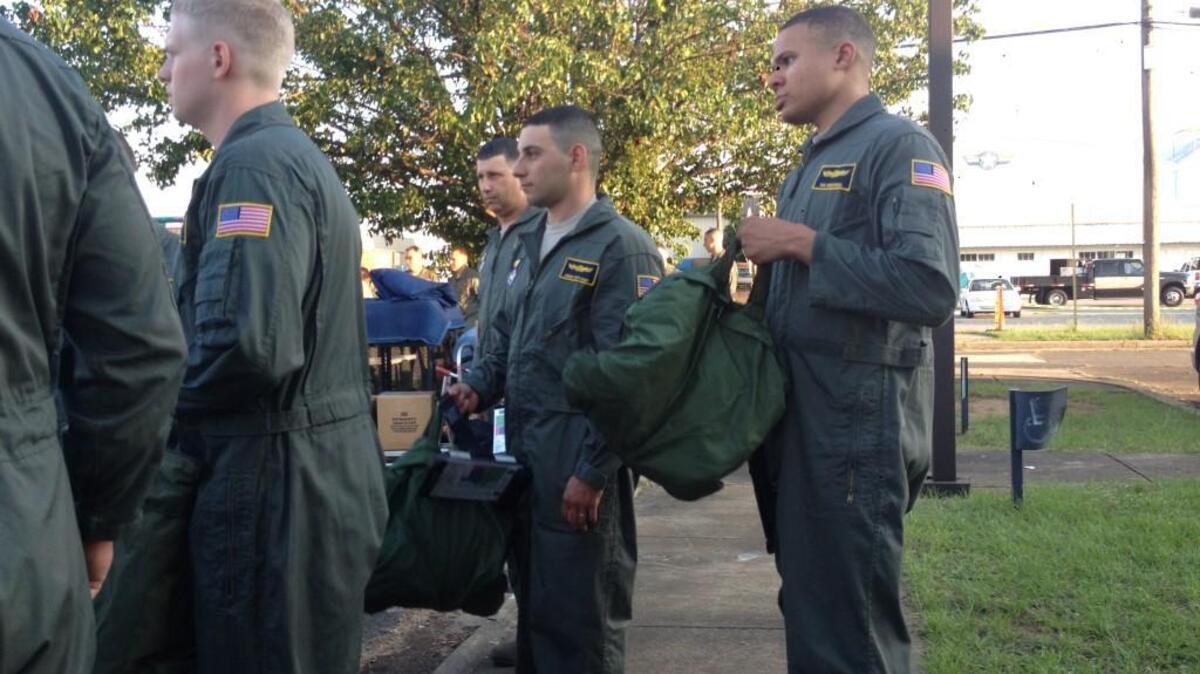 Extras wear airman suits for the filming of "Rampage" at Middle Georgia Regional Airport.