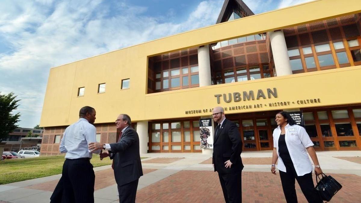 BEAU CABELL/THE TELEGRAPH Macon, Ga., 05/12/2016: John Hope Bryant, left, is welcomed to a Tubman Museum breakfast by Macon Mayor Robert Reichert Thursday.