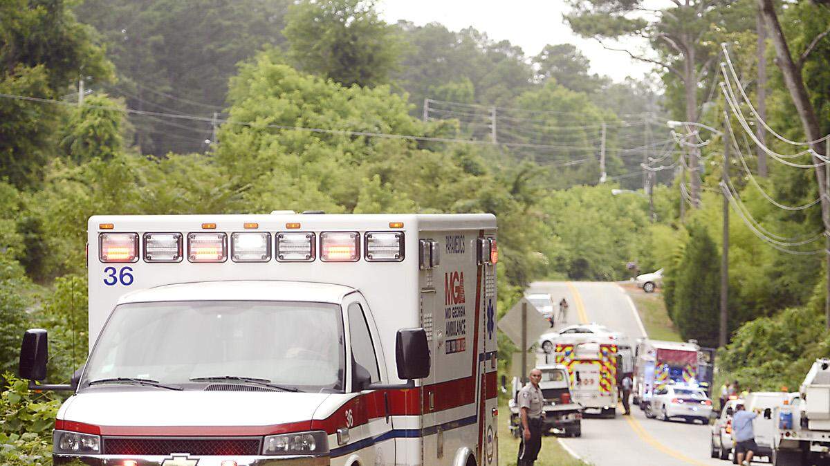 A Mid Georgia ambulance leaves the scene with the victim of a vehicle accident along Rivoli Drive in 2014