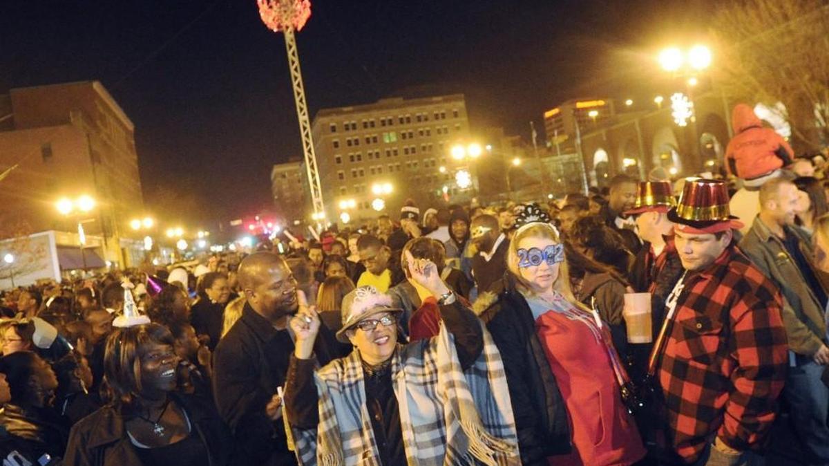 Partygoers dance during the third annual Cherry Blossom ball drop in Cherry Street Plaza as they ring in the start of 2012.