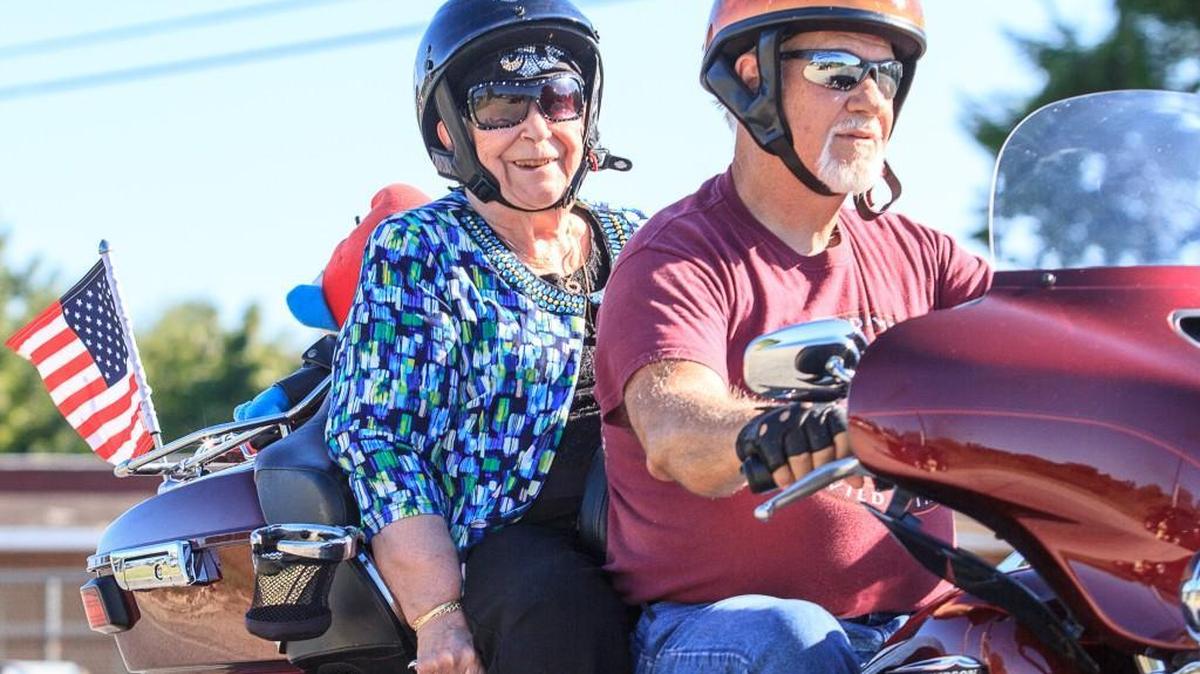 David Owen drives Stella Sarandis down Pio Nono Avenue on her surprise motorcycle ride to celebrate her 90th birthday.