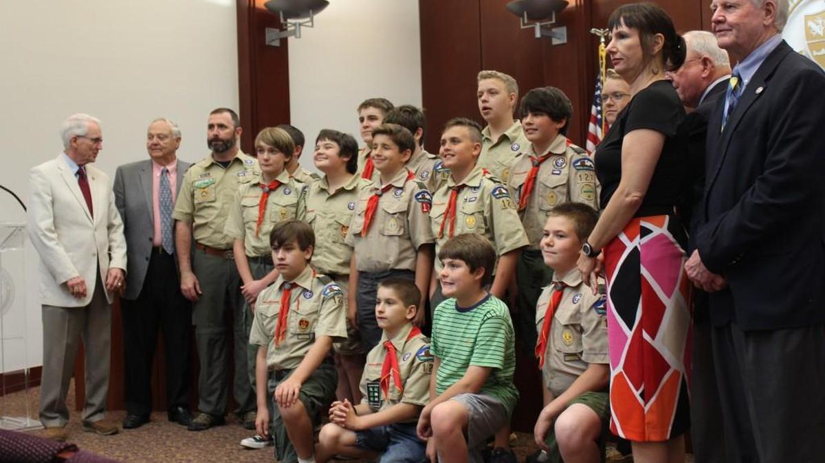 Boy Scouts in Troop 127 pose for a photo with the Houston County commissioners on April 18 after attending a meeting to earn a merit badge.