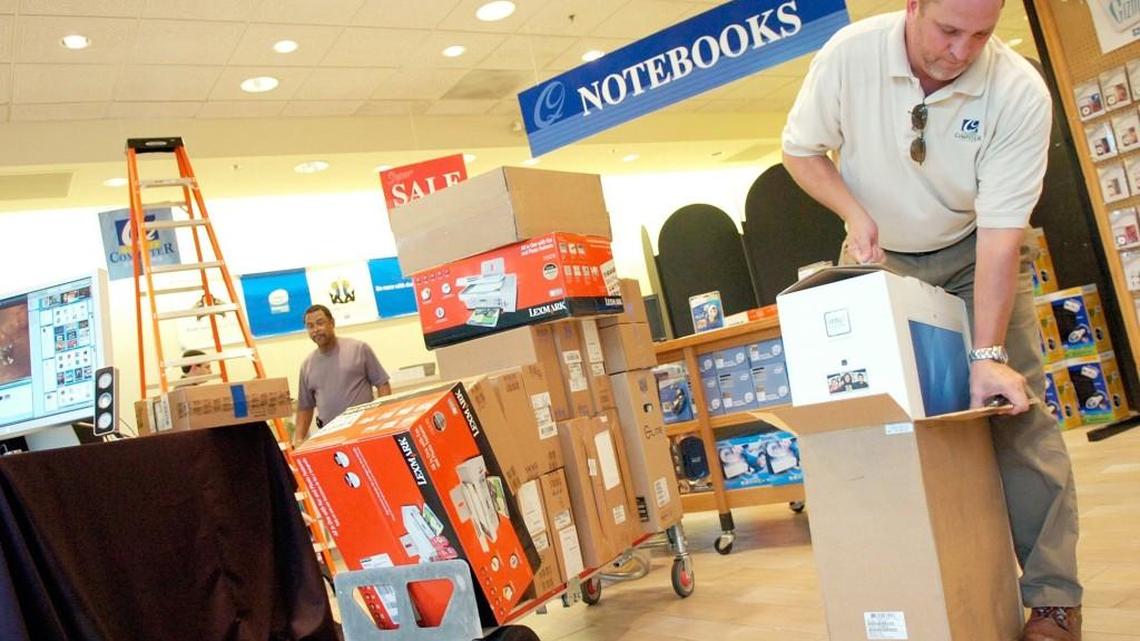 In this Aug. 1, 2007, Telegraph file photo, Quality Computer Systems co-owner Steve Toland sets out an iMac as he prepared for the tax-free weekend.