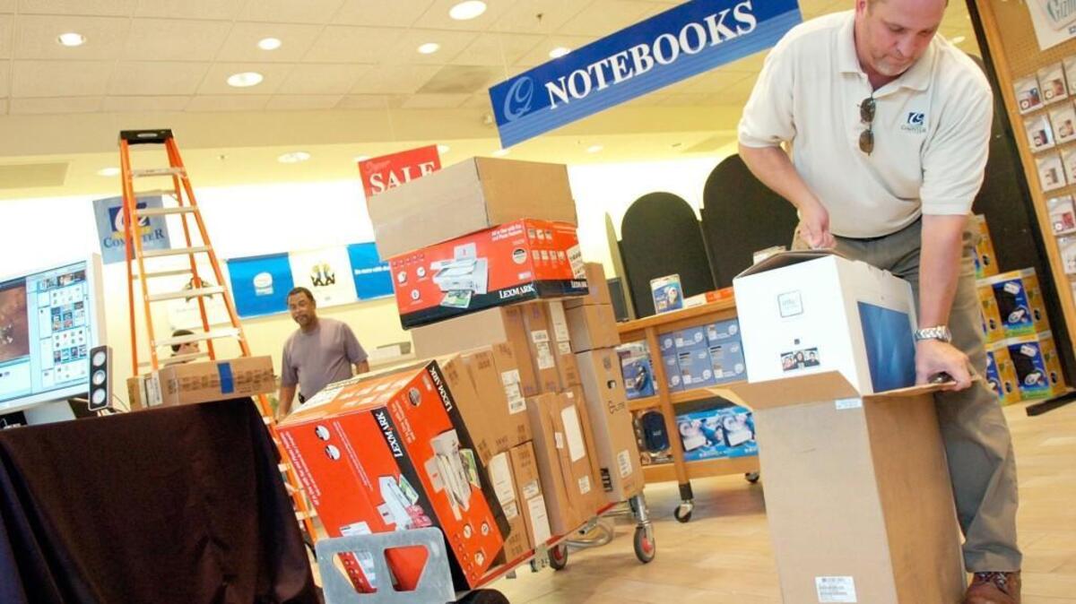 In this Aug. 1, 2007, Telegraph file photo, Quality Computer Systems co-owner Steve Toland sets out an iMac as he prepared for the tax-free weekend.