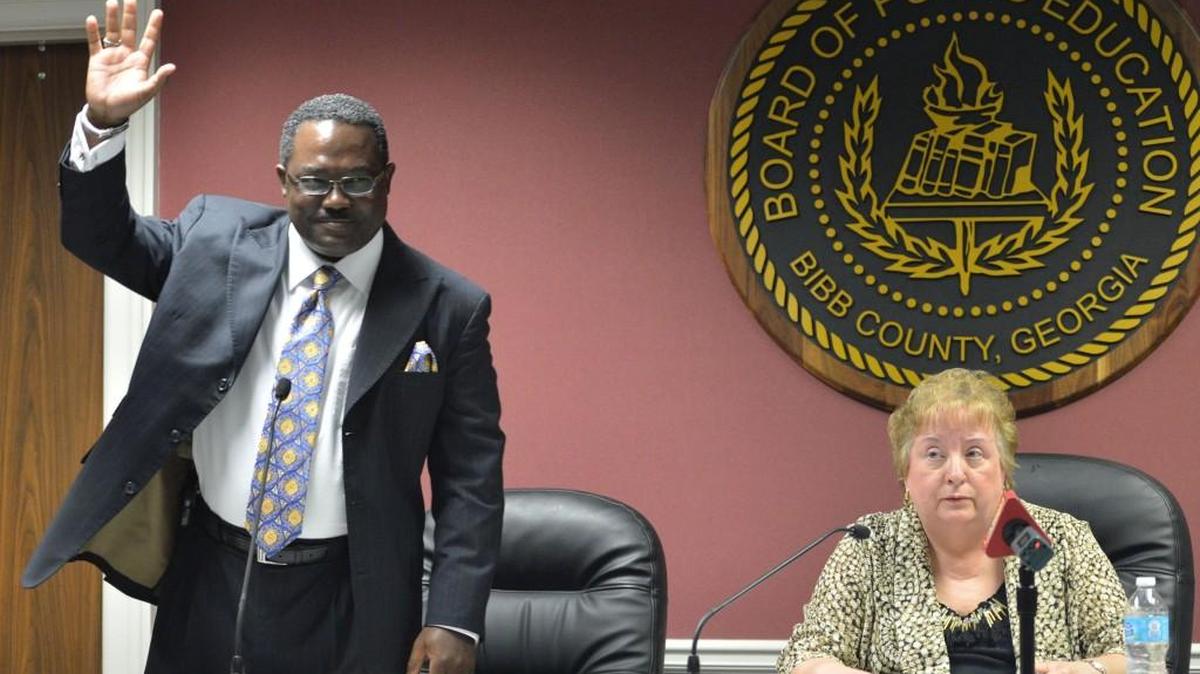 Fomer Bibb County school Superintendent Romaine Dallemand, left, is among those being sued by the school district to recover millions in allegedly lost funds while he was in office.