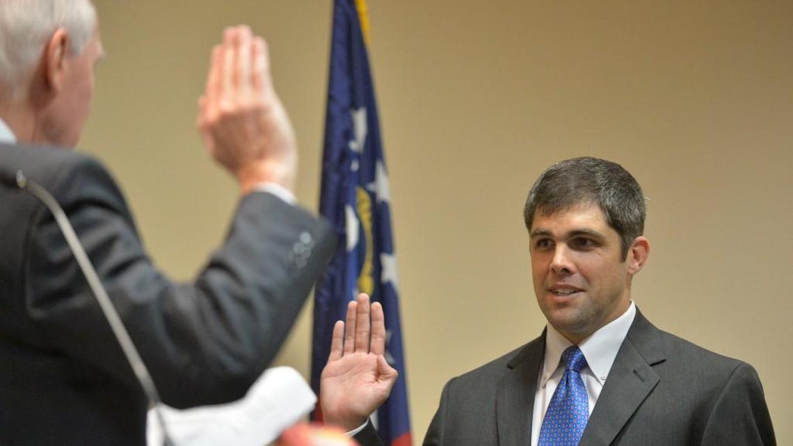 Shaw Blackmon, right, is sworn in Aug. 20, 2015, by Superior Court Judge George Nunn as the new District 146 represenative at Central Georgia Technical College. Blackmon has filed a bill that would make it clear that it’s illegal to take secret “upskirt” photos in Georgia.
