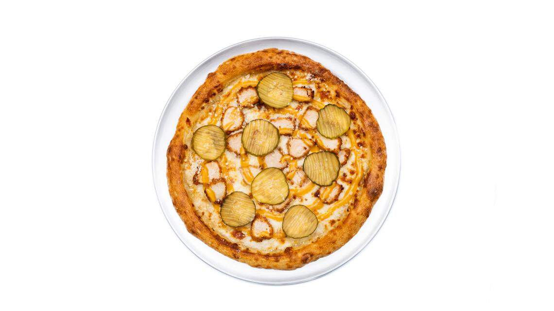 An exclusive menu features five new pizzas, including a pie featuring Chick-fil-A chicken nuggets.