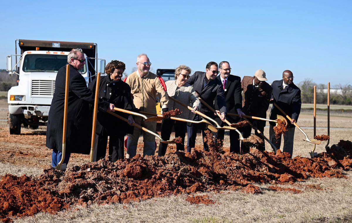 Dignitaries break ground on a runway expansion at the Middle Georgia Regional Airport Tuesday.