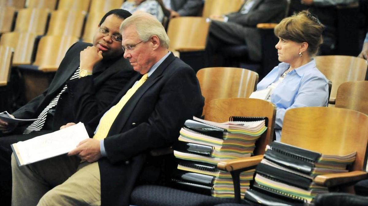 Dale Walker, right, listens to a budget presentation in this 2011, file photo. Walker announced his resignation at Macon-Bibb County manager on April 24, 2017.