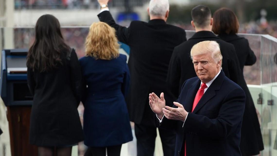 President Donald Trump applauds after Vice President Mike Pence was sworn-in on Capitol Hill in Washington, D.C., on Friday during the presidential inauguration.