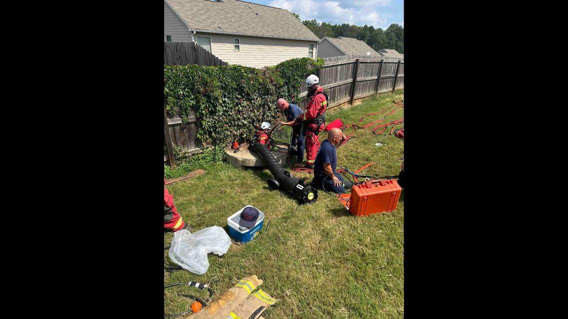 Rescuers worked for over an hour to pull the two puppies out of the narrow storm drain, Paulding County Fire & Rescue said.