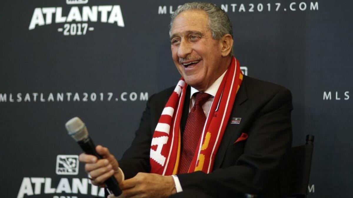 Atlanta Falcons owner Arthur Blank smiles during a news conference announcing the city is getting a Major League Soccer expansion team on Wednesday, April 16, 2014, in Atlanta.