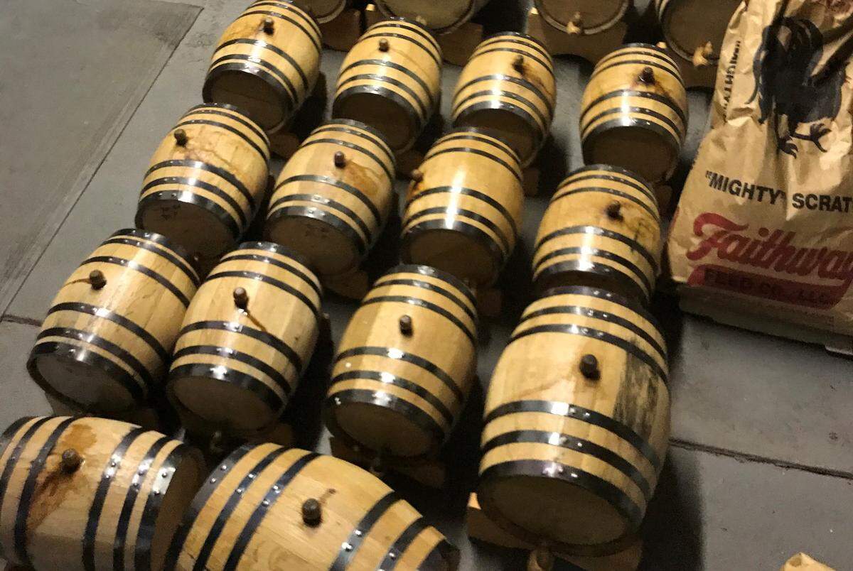 Kegs of suspected white lightning found in a shed in a Putnam County man’s back yard Wednesday, police there said.