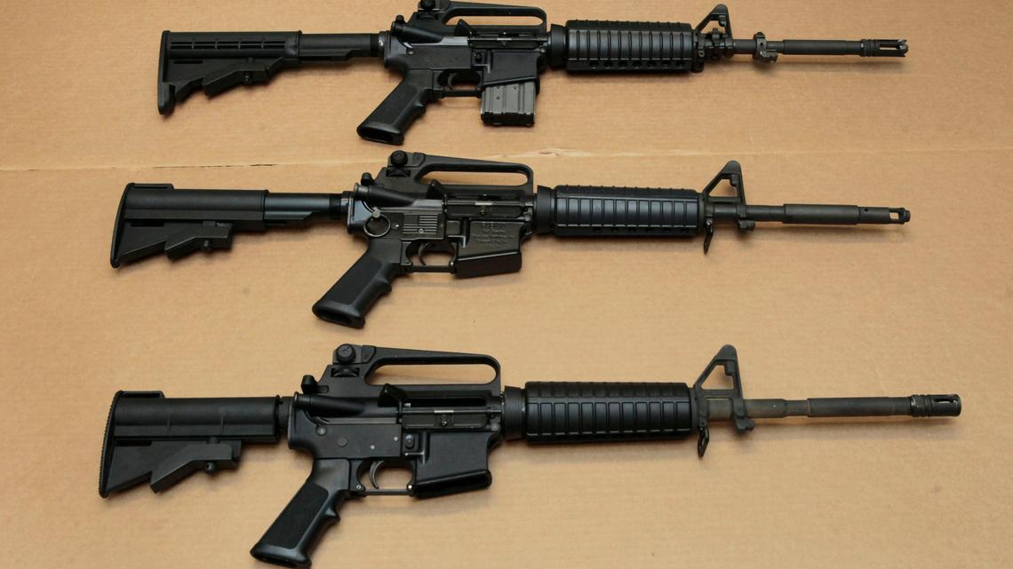 Three variations of the AR-15 assault rifle are displayed at the California Department of Justice in Sacramento in this file photo. The gunmen in two of the nation’s most recent mass shootings, including a massacre at a Texas elementary school, legally bought the assault weapons they used after they turned 18.