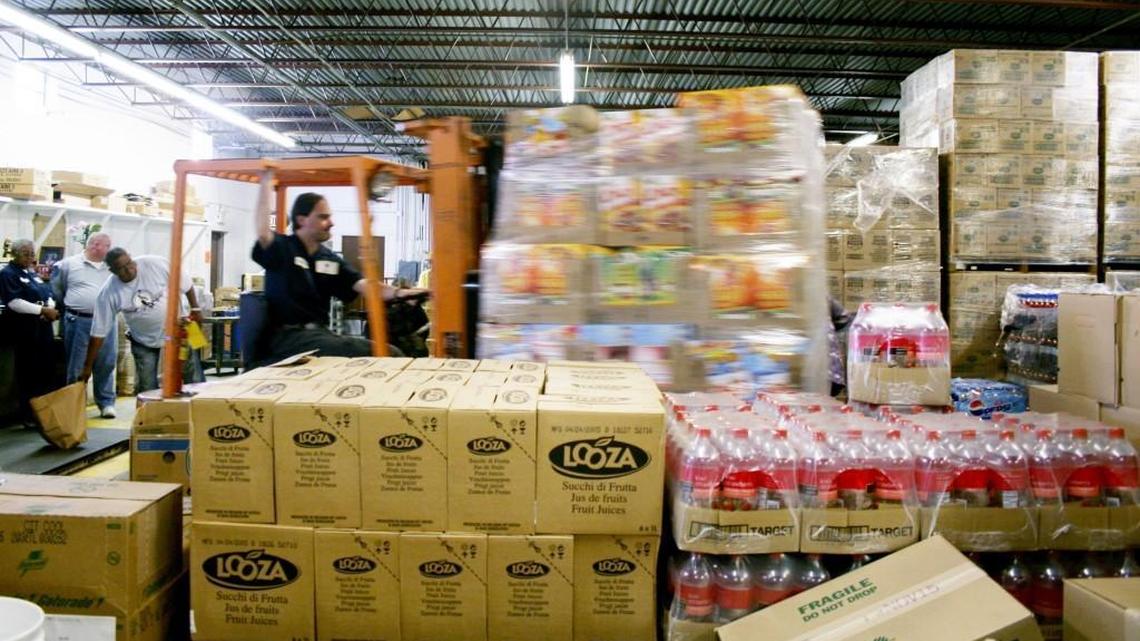 A worker moves a load of cereal through the warehouse at the Middle Georgia Community Food Bank in this 2005 Telegraph file photo.