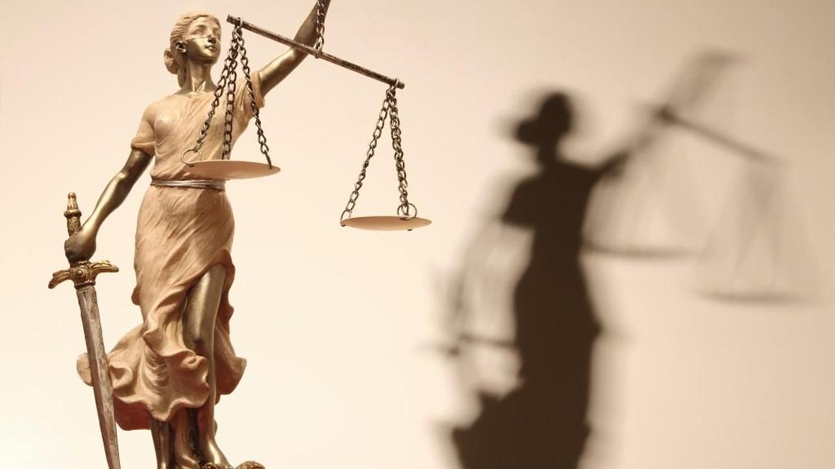 Justice (greek:themis,latin:justitia) with scales and sword.