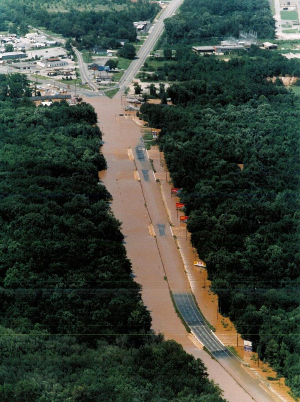 Ga. 247 conecting Macon and Warner Robins flooded after Rocky Creek and Tobesofkee Creek overflowed their banks in July 1994. Nearly two weeks after the flooding, a number of roads and bridges were still closed.