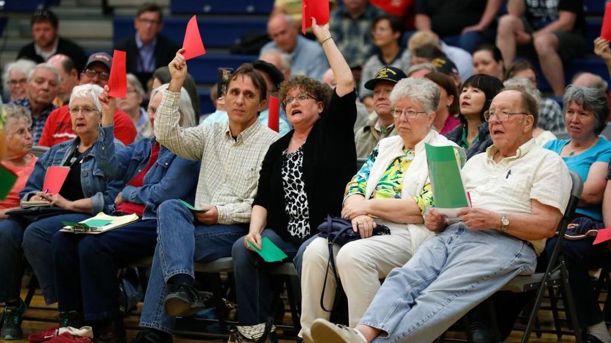 Audience members react as Rep. Rod Blum, R-Iowa, speaks during a town hall meeting, Thursday, May 11, 2017, in Marshalltown, Iowa. Blum is reassuring Iowans fearful of losing health coverage that the House GOP bill is just a “tweak of Obamacare,” after campaigning on repealing the health care law _ and voting last week to gut it. The second-term Blum says “only about 10 percent of Obamacare was changed with this bill,” referring to the measure narrowly passed in the GOP-controlled House.