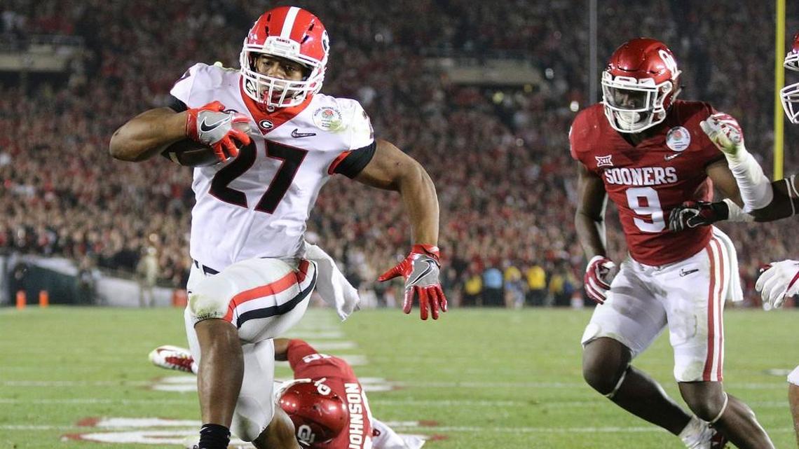 Georgia tailback Nick Chubb scores a touchdown to tie the score 45-45 during the fourth quarter to send it to overtime in the College Football Playoff Semifinal at the Rose Bowl Game on January 1, 2018, in Pasadena, California. Georgia went on to beat Oklahoma 54-48 in double overtime.