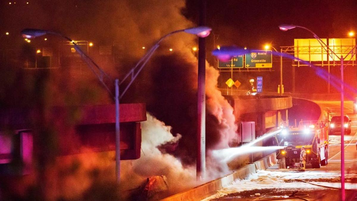 Smoke billows from a section of an overpass that collapsed from a large fire on Interstate 85 in Atlanta. The collapse highlighted the region’s reliance on cars and mass transit advocates hope the traffic headaches while the interstate is repaired will spur new interest in expanding rail and bus routes in the congested city.