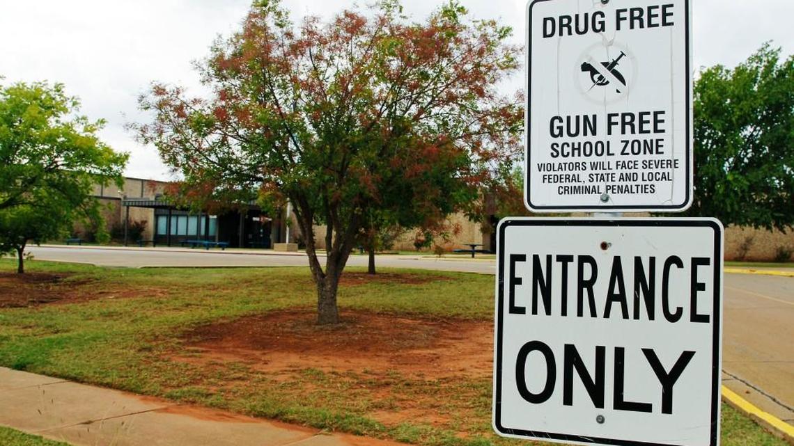 A sign declaring Stillwater Junior High School as a drug free and gun free zone is pictured outside the school in Stillwater, Oklahoma, where in 2012 a 13-year-old student shot and killed himself in a hallway at the school before classes began.