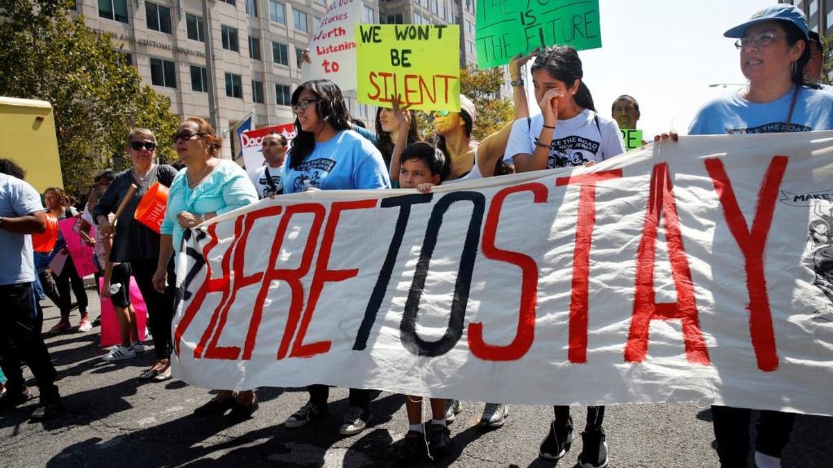 Cielo Mendez, 17, of Plainfield, N.J., who is a DACA recipient, second from left with banner, marches next to Gabriel Henao, 7, and Kimberly Armas, 15, of Elizabeth, N.J., in support of the Deferred Action for Childhood Arrivals program, known as DACA, outside of Immigration and Customs Enforcement (ICE), in Washington, Tuesday, Sept. 5, 2017. President Donald Trump plans to phase out the DACA program that has protected hundreds of thousands of young immigrants brought into the country illegally as children and call for Congress to find a legislative solution.