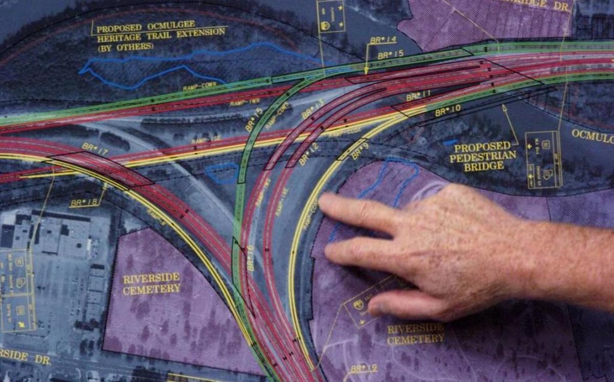 Residents trace the old and new interchange system of I-75 and I-16 during a meeting with Georgia Department of Transportation officials.