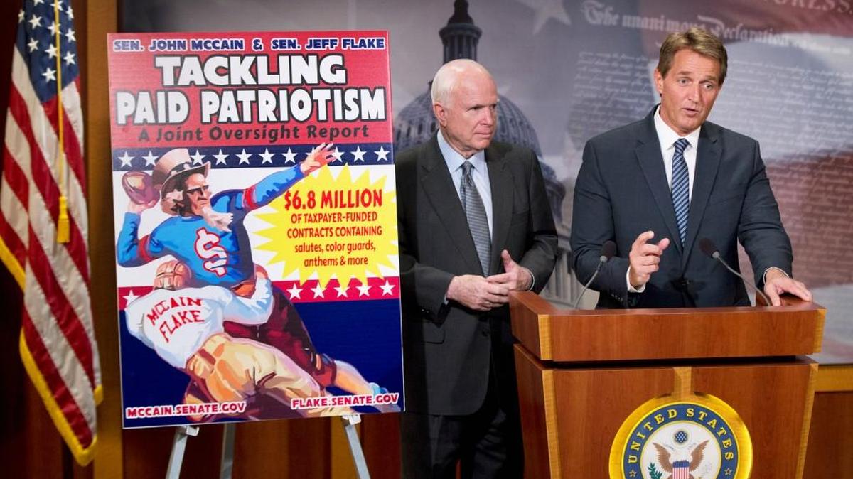Sen. John McCain, R-Ariz., left, and Sen. Jeff Flake, R-Ariz., talk to reporters about “paid patriotism” during a news conference on Capitol Hill in Washington, Wednesday, Nov. 4, 2015.The senator discussed a report on 'patriotism for profit' practices at pro sporting events, detailing 'widespread evidence of the Defense Department paying professional sports teams and leagues such as the NFL, MLB, and NHL to honor American soldiers at sporting events.