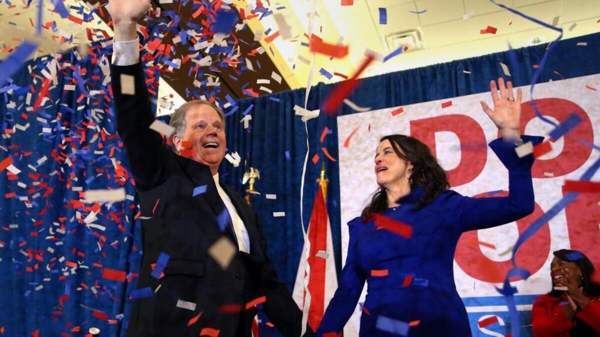 Democratic candidate for U.S. Senate Doug Jones and his wife Louise wave to supporters before speaking Tuesday, Dec. 12, 2017, in Birmingham, Ala. Jones defeated Republican Roy Moore, a one-time GOP pariah who was embraced by the Republican Party and the president even after facing allegations of sexual impropriety.