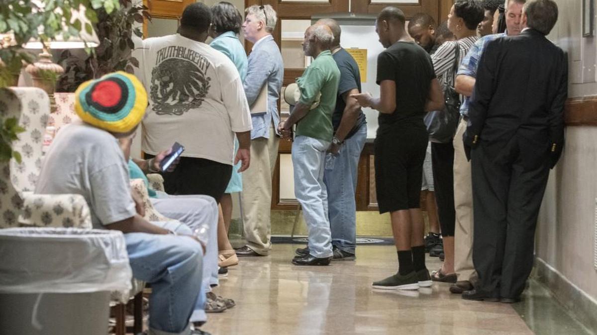 JASON VORHEES/THE TELEGRAPH Macon, GA, 07/03/2018:
Macon-Bibb County citizens stand outside the commission chamber during a commission meeting Tuesday night to vote on restoring funding for public transit, libraries, parks and recreation and outside agencies.