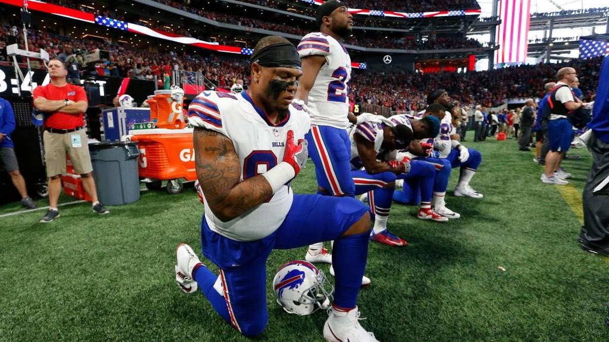 Some Buffalo Bills players take a knee during the national anthem before the first half of an NFL football game between the Atlanta Falcons and the Buffalo Bills, Sunday, Oct. 1, 2017, in Atlanta.