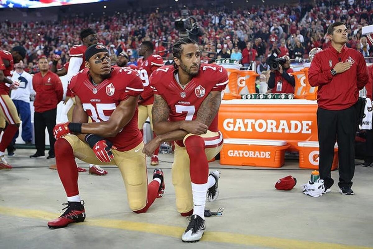 Colin Kaepernick (7) began taking a knee during the national anthem last year to protest police brutality.