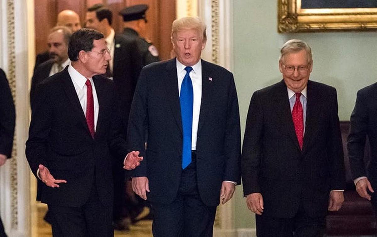 President Trump, escorted by Sen. John Barrasso and Senate Majority Leader Mitch McConnell, popped by Congress to twist some arms.