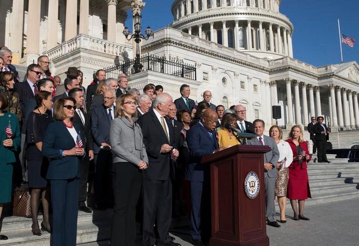 Congresspeople call for action on gun safety legislation on Oct. 4.