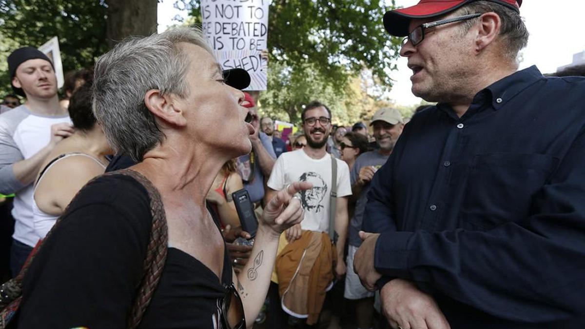 Protesters with opposing views face off at a ‘Free Speech’ rally in Boston.