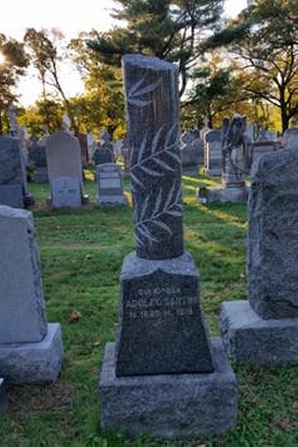 The tombstone of Adolfo Sartini in Saint Michael Cemetery in Boston.