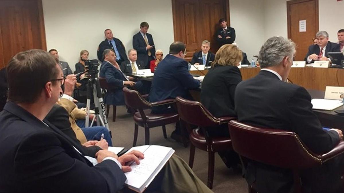 State Sen. John F. Kennedy, just right of center during the January hearing on SR 24.